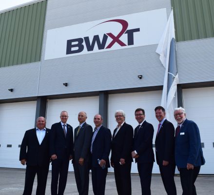 Warden Halliday stands with Mayor Boddy, MP Miller, MPP Walker and delegates from Bruce Power, BWXT and Brotech,