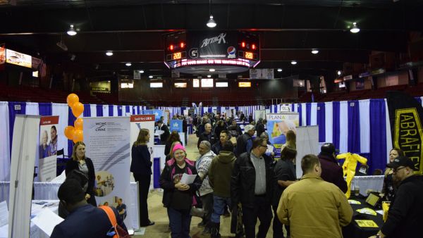 Photo of job seekers and businesses on the arena floor at the 2019 regional job fair